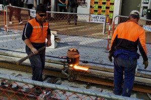 Workers_join_tram_tracks_in_Christchurch